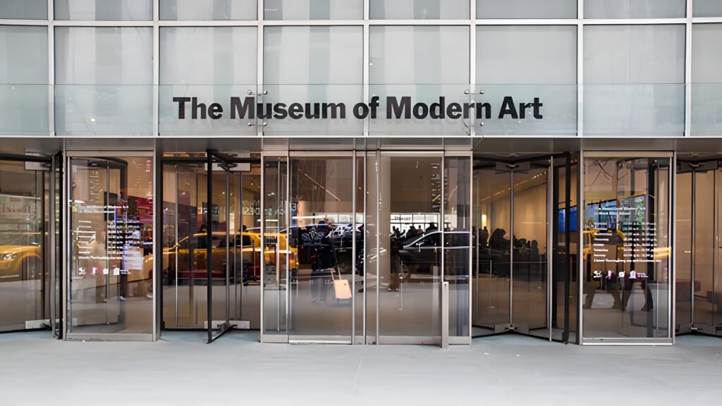 Contemporary artwork and modern paintings hanging inside a brightly lit gallery at MoMA.